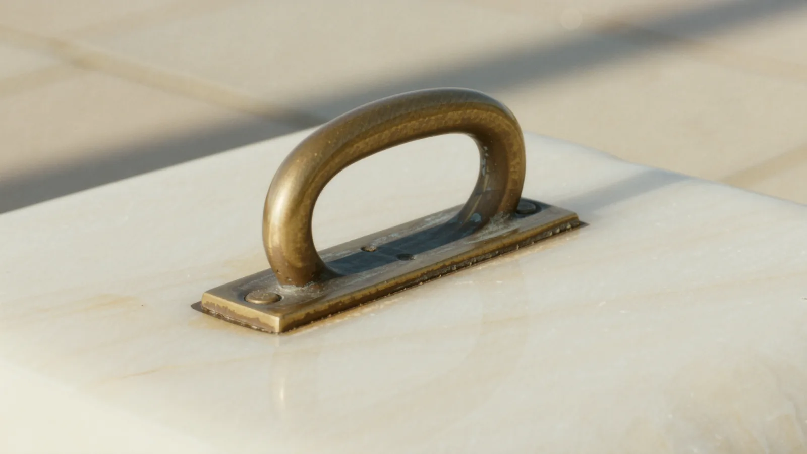 A brass balance scale with a folded note on one pan